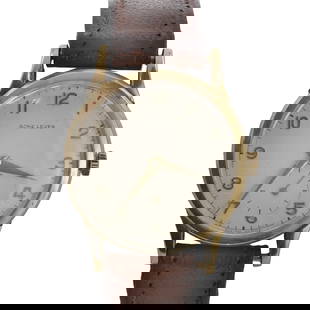 A 9ct gold Acme Lever mechanical strap watch: A 9ct gold Acme Lever mechanical strap watch with a 32mm diameter case, a silvered dial, gilt Arabic numerals, gilt sword hands, subsidiary seconds dial, Birmingham 1958, to a later leather strap and