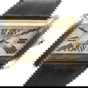 An 18ct gold Cartier Tank Divan automatic strap watch,: An 18ct gold Cartier Tank Divan automatic strap watch, ref. 2603, the rectangular horizontal case, 38mm, with a silvered guilloche dial, black Roman numeral, blued hands, secret signature at 7, sapphi
