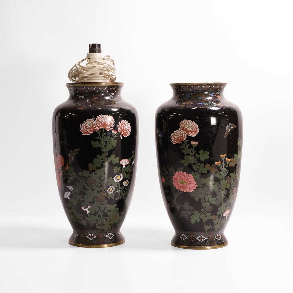 A pair of Japanese cloisonné vases,: A pair of Japanese cloisonné vases, 19th/20th century, each of tapering form, enamelled with butterflies amongst peonies, chrysanthemums and morning glories, against a black ground, 34cm high (2)