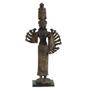 A large composite figure of an Indian deity,: A large composite figure of an Indian deity, 20th century, of a multi-headed and armed figure, on a black painted wooden base, 52cm wide 24cm deep 121cm high