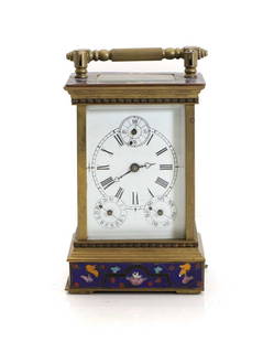 A 20th century French champleve calendar carriage clock,: A 20th century French champleve calendar carriage clock, the eight-day movement, the dial with with Roman numerals, a seconds dial, and the days and dates on subsidiary dials, the columns, top and pli