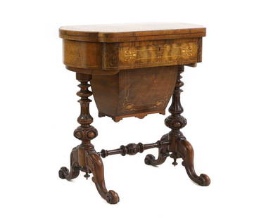 A Victorian walnut games table,: A Victorian walnut games table, the foldover top revealing an inlaid interior for draughts and backgammon, on stretchered end supports 66cm wide 42cm deep 70cm high Condition Report: minor scuffs, kno