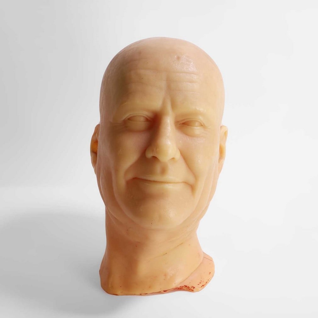 A cast wax head of a gentleman,: A cast wax head of a gentleman, late 20th century, incised to the back of the neck 'HENRICK FREEMAN YOUNG', 19cm wide 24cm deep 34cm high Condition Report: Red marks throughout. Chip and loss to one e