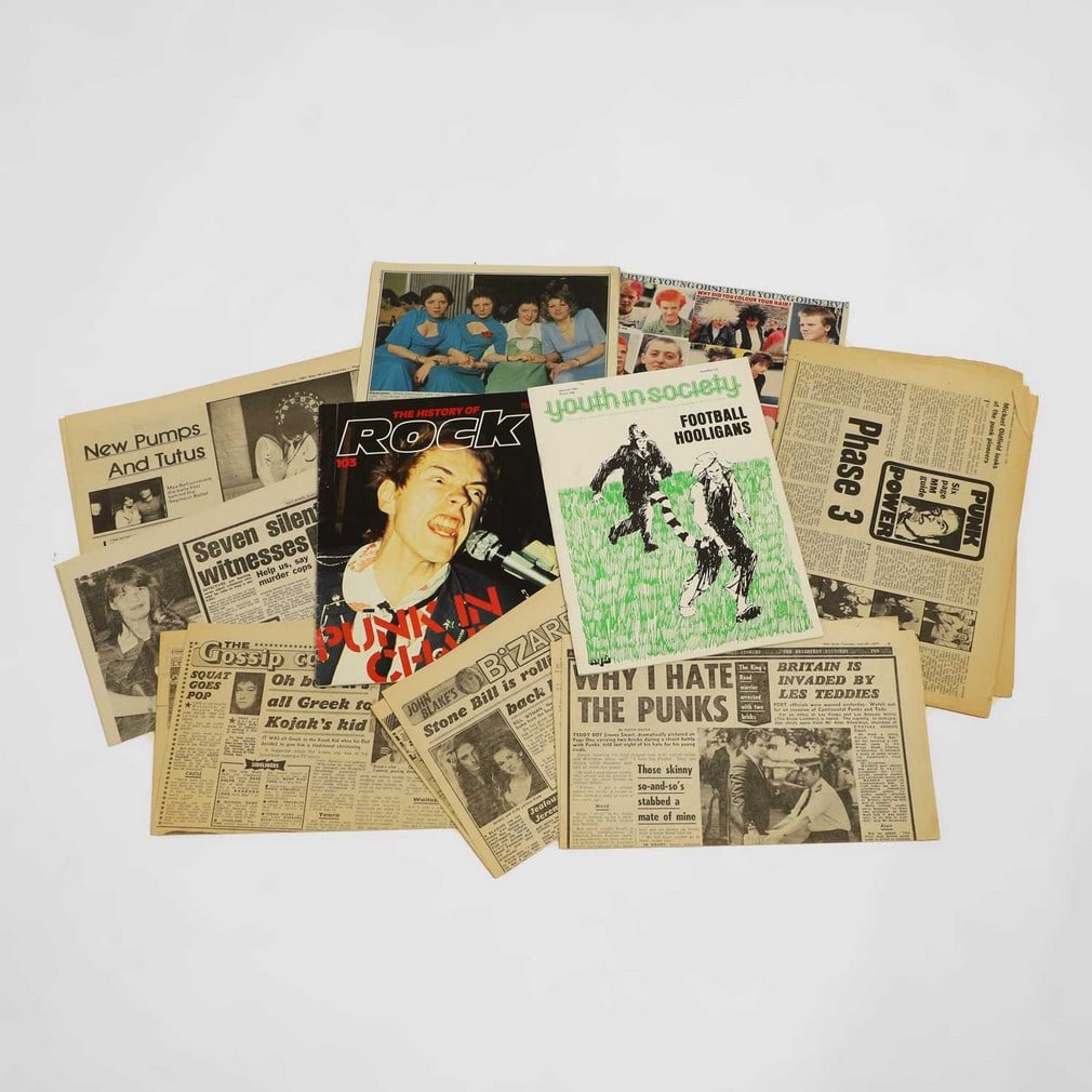 A Sex Pistols picture sleeve,: A Sex Pistols picture sleeve, Sex Pistols 45rpm 'Holidays in the Sun' in Jamie Reid picture sleeve, together with four original stills for 'Jubilee', 1977, and a selection of punk-related press cuttin