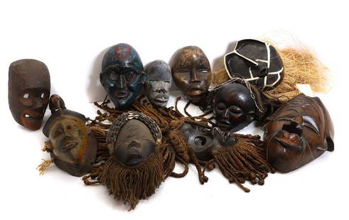 A collection of carved African masks,: A collection of carved African masks, 20th century, including some ceremonial and West African examples, largest 40cm high (10)