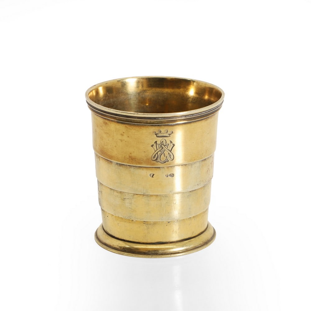 A Victorian silver gilt collapsible beaker,: A Victorian silver gilt collapsible beaker, by Thomas Johnson I, London 1862, of tapering form, the moulded rim above four graduated sections, the cushioned moulded base removable on standard thread,
