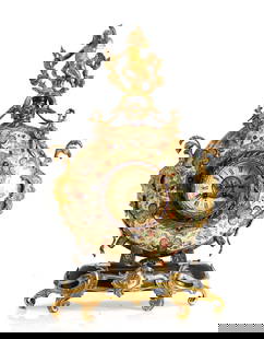 A gilt metal mounted pottery mantel clock,: A gilt metal mounted pottery mantel clock, late 19th century, Austrian or Hungarian, in the manner of Zsolnay Pecs or Fischer, of moon flask form, with a two train movement striking on a bell, mounted
