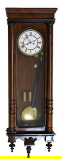 A Vienna wall clock,: A Vienna wall clock, with an enamelled dial, mounted in a glazed walnut case, with a pendulum, weights, mounted with three drop finials, 98cm high Condition Report: Fair overall. All pieces in the lot