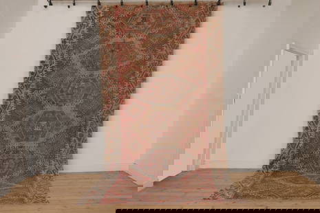 A kilim flatweave wool carpet,: A kilim flatweave wool carpet, 20th century, the field woven with seven geometric medallions, within a pale border, 400 x 196cm Condition Report: Tears and separation to central weave. Fading and disc