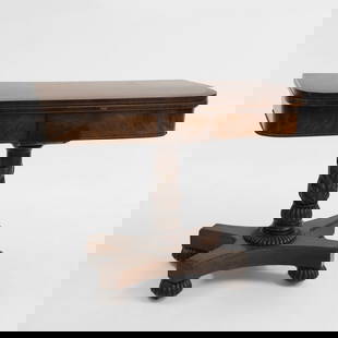 A George IV/Regency figured mahogany card table,: A George IV/Regency figured mahogany card table, green felt, the rectangular fold-over top with rounded corners, over a plain frieze centred with a tablet, carried on a leaf moulded turned baluster pe