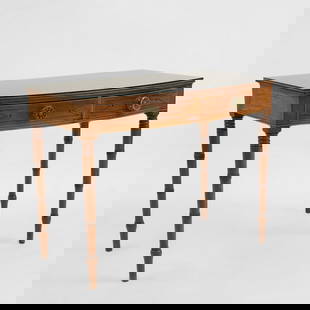 A Regency rosewood and box line inlaid side table,: A Regency rosewood and box line inlaid side table, the bow front top over a pair of ebony line inlaid frieze drawers fitted with stamped brass handles, raised on ring turned tapering &#8216;bamboo&#82