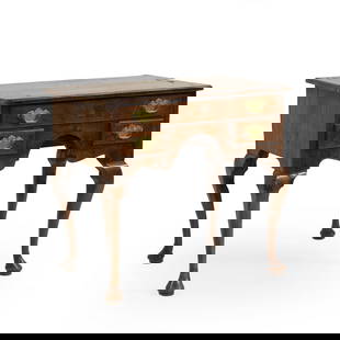 A walnut lowboy,: A walnut lowboy, c.1760, with quarter veneered top, one long drawer over two short, raised on cabriole legs, 76.5cm wide 50cm deep 70cm high Condition Report: Some loss to veneer on the side and the b