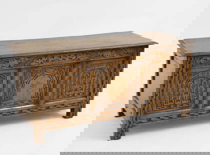 An oak coffer,: An oak coffer, 20th century, with three panels to front carved with arches, 117cm wide 49cm deep 54cm high Condition Report: Scratches to surface, chips to back, top separated from hinges.