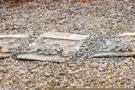 A pair of carved stone architectural features,: A pair of carved stone architectural features, 19th century, possibly corbels, of square section, with foliate decoration, largest 44cm wide (2)
