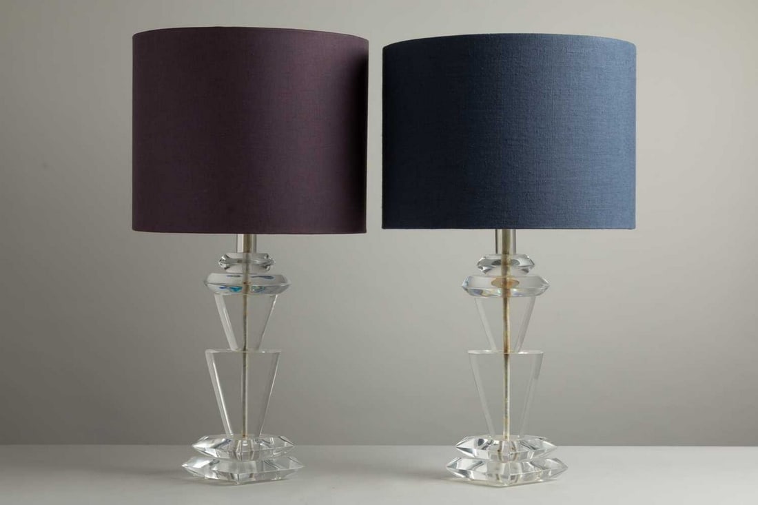 A pair of sculptural Lucite table lamps,: A pair of sculptural Lucite table lamps, 1970s, each with triangular details on a stepped base, signed 'Van Teal', with a blue shade, 43.5cm diameter 81.5cm high (2) Condition Report: Working good ove