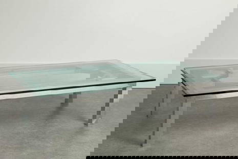 An aluminium and glass coffee table,: An aluminium and glass coffee table, 1970s, with a bevelled-edge glass top, 183cm wide 106.5cm deep 45cm high Condition Report: Good overall.
