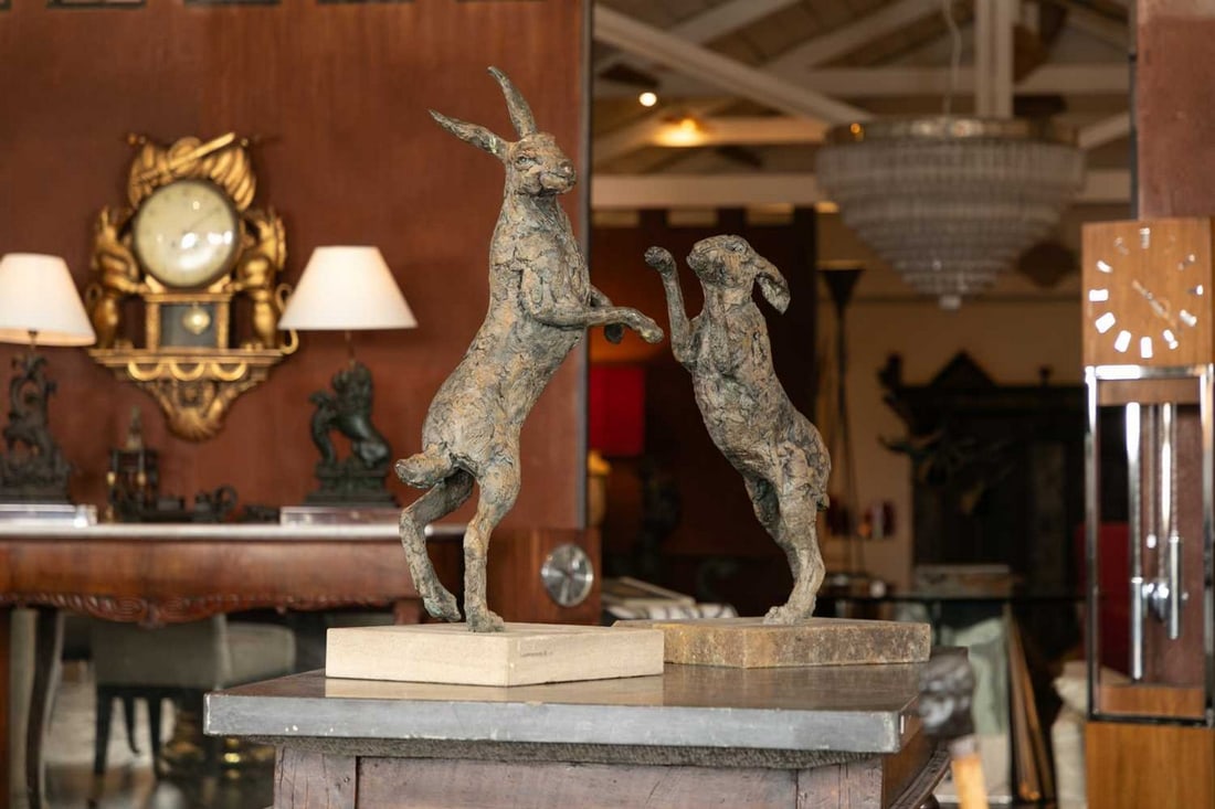 ▲ Hamish Mackie (b.1973),: ▲ Hamish Mackie (b.1973), 'Boxing Hares', a two-piece bronze sculpture, each element signed and dated '2009', and numbered '2/12', 78cm wide 29cm deep 78.5cm high (2)