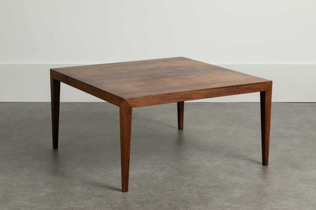 § A rosewood coffee table,: § A rosewood coffee table, 1960s, Danish, designed by Severin Hansen for Haslev Møbelsnedkeri, with a square top and tapering supports, 95.5cm square 50.5cm high Article 10 Transaction Speci