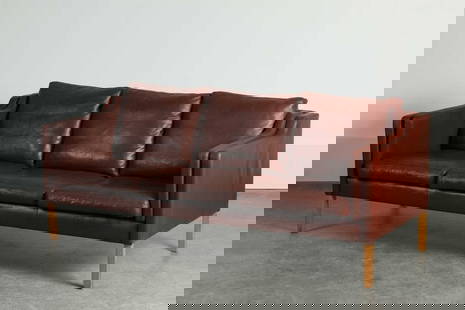 A burgundy leather three-seater settee,: A burgundy leather three-seater settee, 1960s, Danish, in the manner of B&#248;rge Mogensen, 200cm wide 85cm deep 80cm high Condition Report: Some signs of wear. Supports fair - with some marks., seat