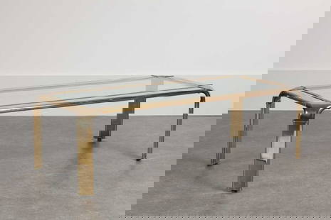 A bicolour brass and glass coffee table,: A bicolour brass and glass coffee table, 1970s, designed by John Widdicombe for Mastercraft, with a bevelled inset glass top, 136cm wide 61cm deep 42cm high Condition Report: Some wear to the finish a