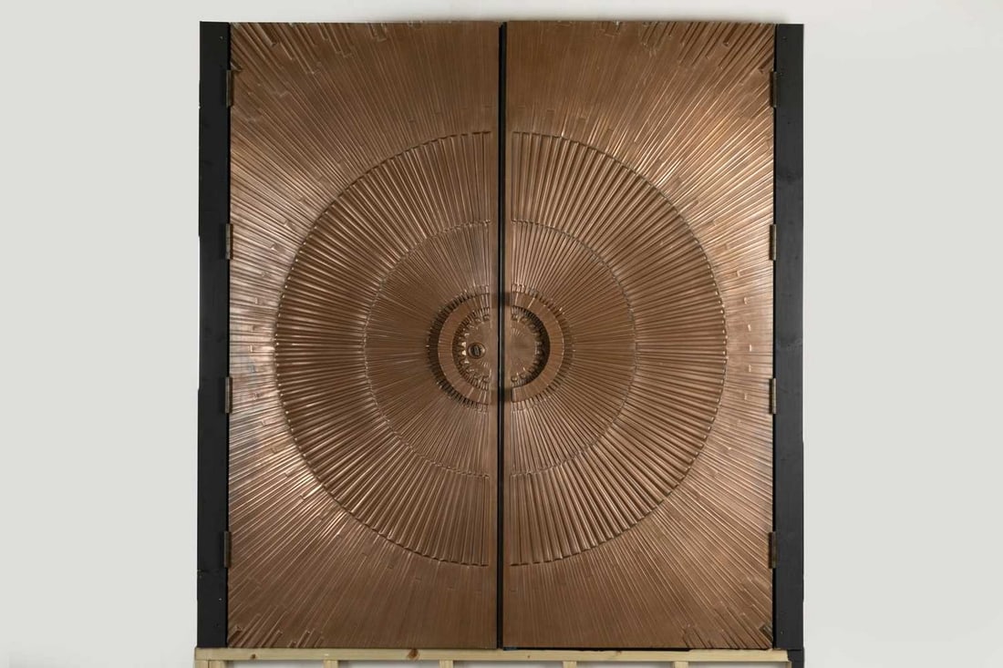 A pair of impressed and bronze resin doors, (1 of 2)