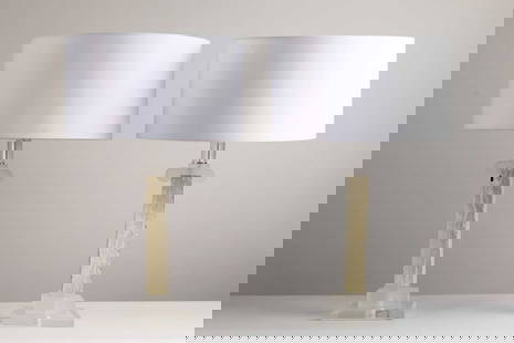 A pair of Lucite and faux marble table lamps,: A pair of Lucite and faux marble table lamps, 1970s, each with a square column with an Ionic capital, on a stepped plinth, 18cm wide 18cm deep 54cm high to top of fitting (2) Condition Report: Some ch