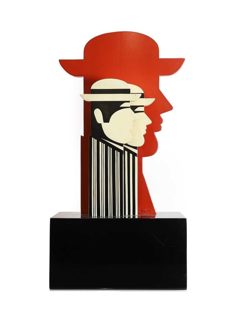 ▲ Yannis Gaitis (Greek, 1923-1984): ▲ Yannis Gaitis (Greek, 1923-1984) Three heads painted wood, the largest head signed 'Gaitis' largest 44.5cm high 60.5cm high overall on a wooden base Provenance: The property of a European coll