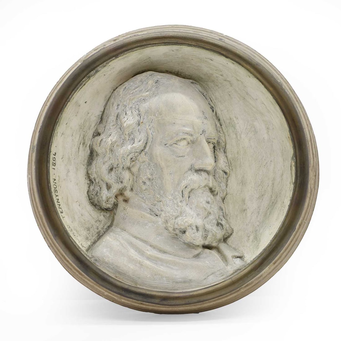 A plaster portrait relief of Alfred, Lord Tennyson,: A plaster portrait relief of Alfred, Lord Tennyson, after Thomas Woolner, R.A (1825-1892), the circular plaster relief portrait medallion, depicting the head and shoulders of Alfred, Lord Tennyson, t
