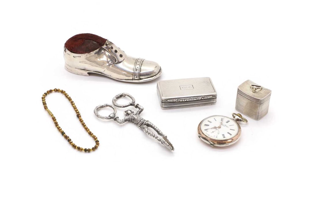 A silver pill box,: A silver pill box, by B H Joseph & Co (Barnet Henry Joseph), Chester, 1891, shaped as a caddy with ribbed sides, 3.4cm wide, a silver snuff box with gilded interior, and rose pattern to the side,