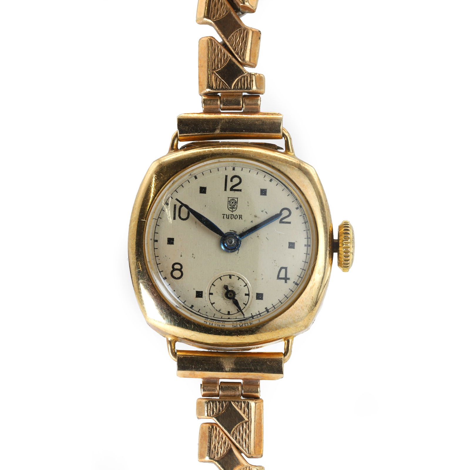A ladies' 9ct gold mechanical bracelet watch,: A ladies' 9ct gold mechanical bracelet watch, with a cushion shaped case, 20mm x 20mm, a silvered dial signed Tudor, black Arabic numerals and dot hour markers, blued baton and swell hands, subsidiary