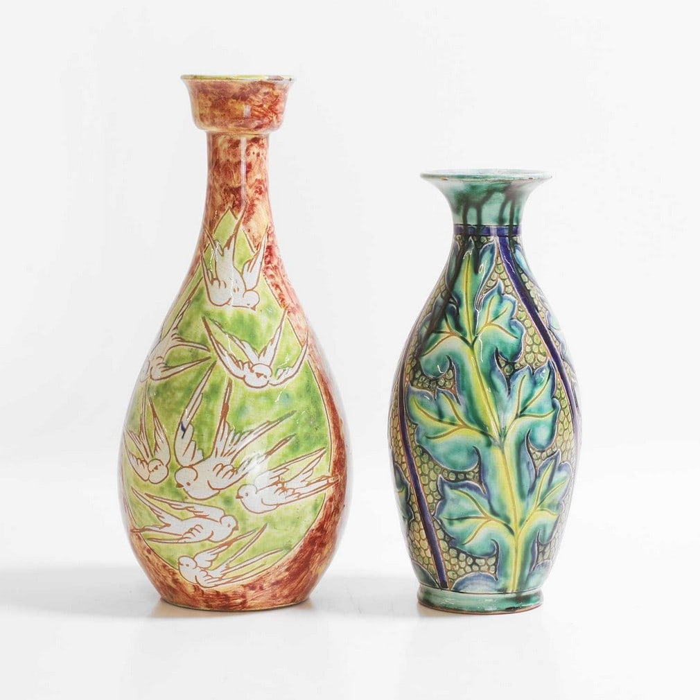 Della Robbia Pottery,: Della Robbia Pottery, a bottle vase, c.1900, of slender form, with a tulip form rim, incised with two panels of swallows on a green glaze, with a mottled buff ground, with Galleon mark 'Shirley DR' an