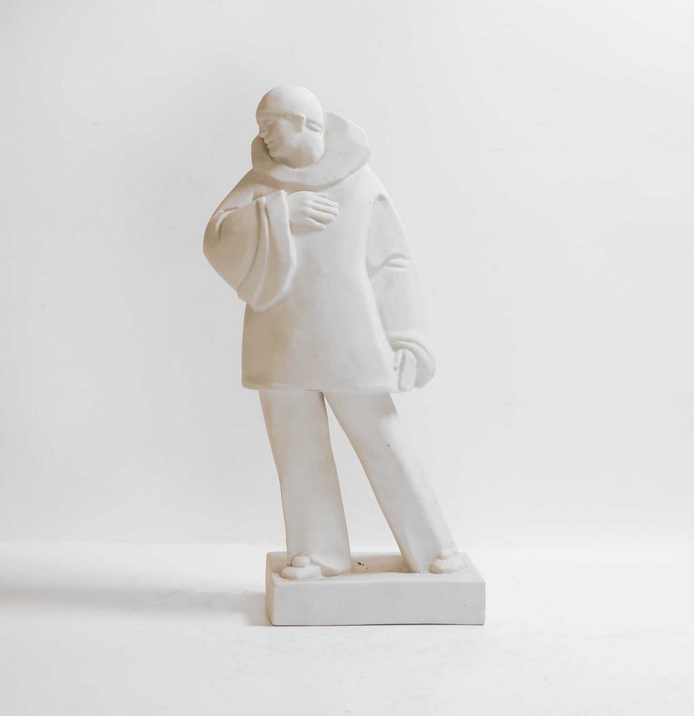 Eugène Riboulet (French-Irish, 1883-1972),: Eugène Riboulet (French-Irish, 1883-1972), a French Art Deco bisque figure of a clown, c.1930s, inscribed to the front 'Paillasse' (Clown), signed to the side 'Eug. Riboulet', 22cm wide 10.5cm de