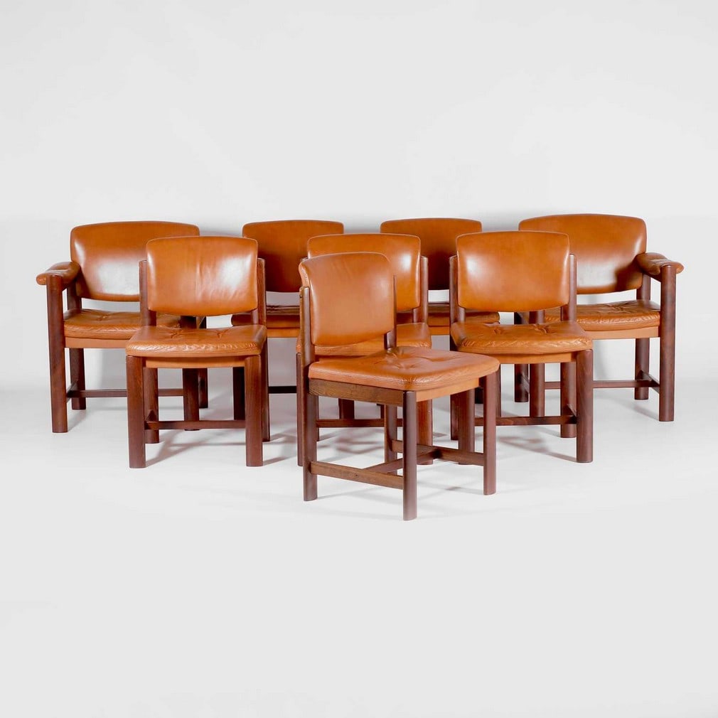 § Ekornes,: § Ekornes, a set of eight dining chairs, c.1960s, comprising two carvers and six armless examples, each upholstered in tan leather and raised on a rosewood-finished frame, 69cm wide 60cm deep 79c
