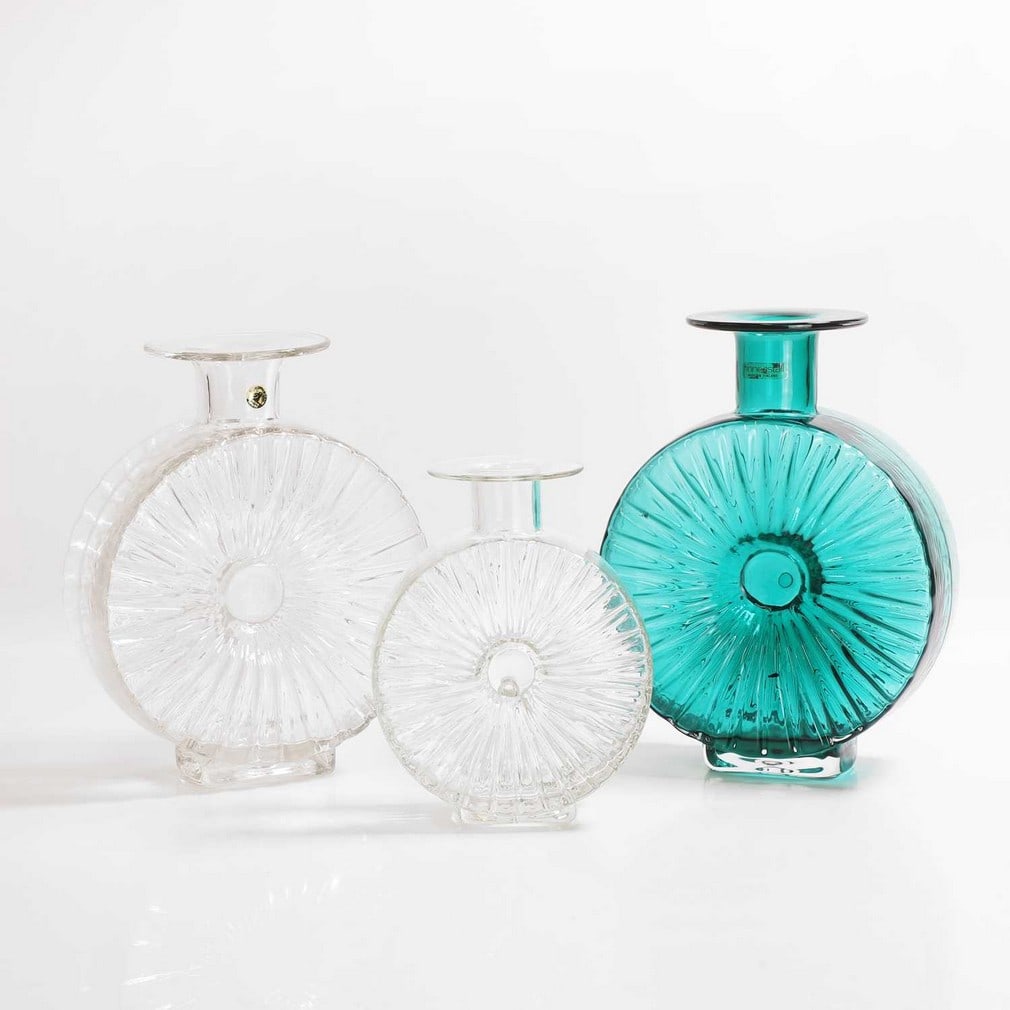 Helena Tynell (Finnish, 1918-2013) for Riihimäen Lasi Oy,: Helena Tynell (Finnish, 1918-2013) for Riihimäen Lasi Oy, two large 'Aurinkopullo' (Sun Bottle) glass vases, in clear and teal, both labelled 'Riihimäen Lasi' and 'Finncristal', 22.5 and 23cm high,