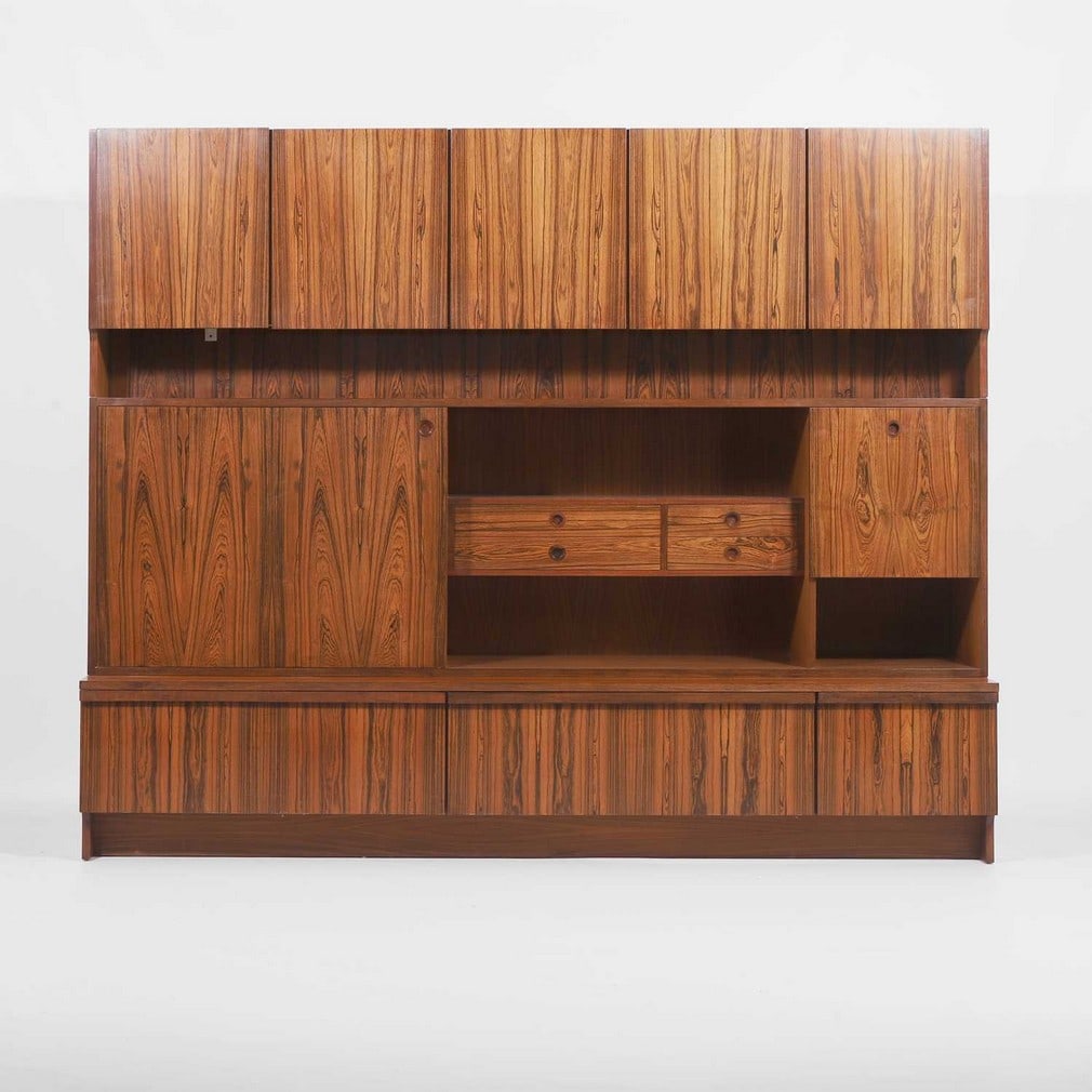 § Robert Heritage (1927-2008) for Archie Shine,: § Robert Heritage (1927-2008) for Archie Shine, a rosewood 'Bridgeford' wall unit, c.1970s, designed for Archie Shine, the upper section with three cupboards, opening to reveal shelved sections,