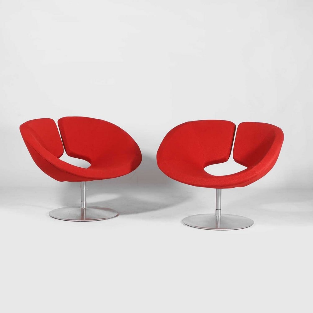 Patrick Norguet (French, b.1969) for Artifort,: Patrick Norguet (French, b.1969) for Artifort, a pair of 'Apollo' swivel chairs, each upholstered in red fabric, and raised on a circular aluminium swivel base, with manufacturer's metal label, 90.5cm