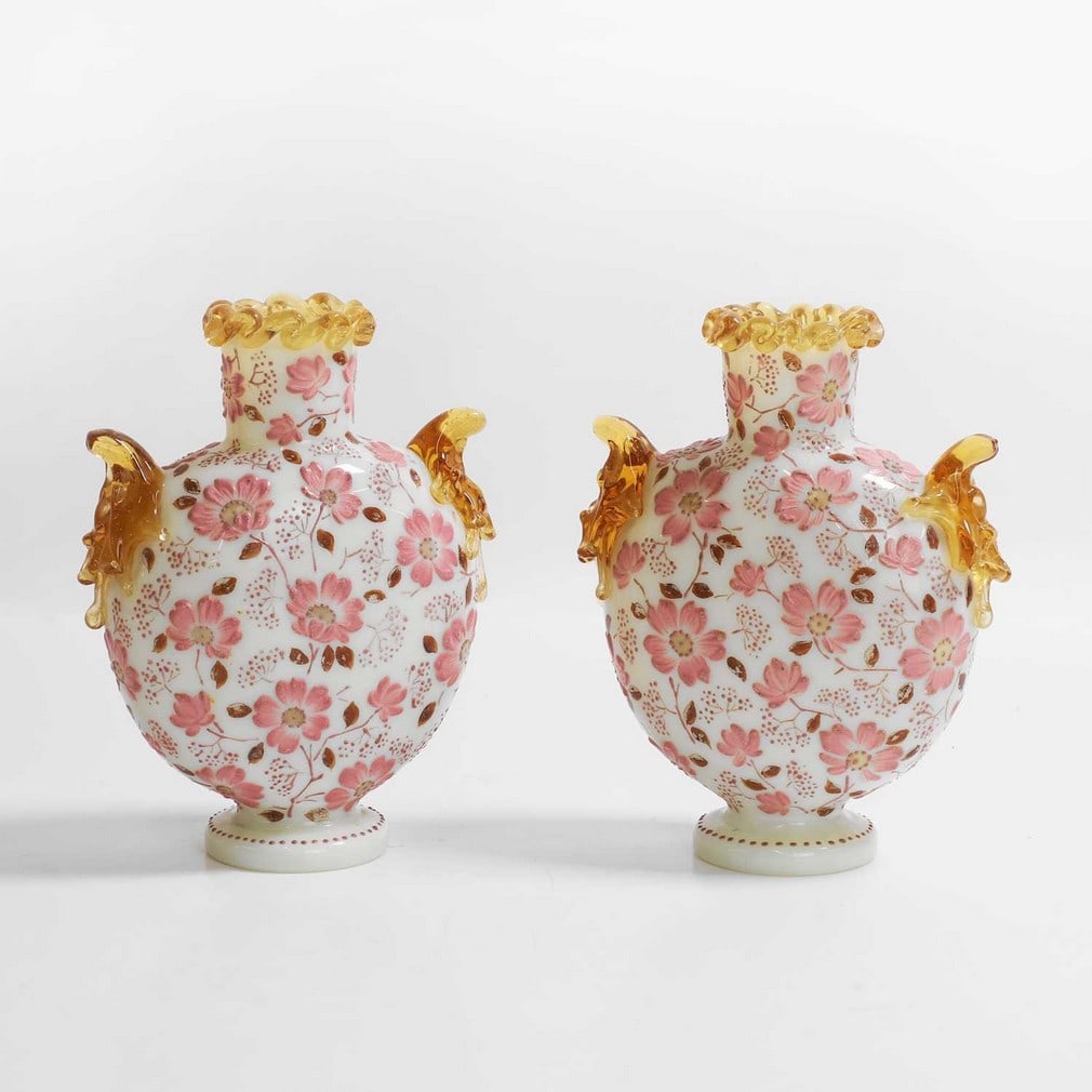 A pair of Harrach opaline glass vases,: A pair of Harrach opaline glass vases, late 19th century, Bohemian, each of compressed globe and shaft form, with amber glass applications, enamelled with flowers in relief, 15.5cm high (2)