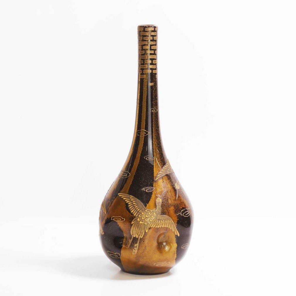 A Loetz 'Ophir' glass vase,: A Loetz 'Ophir' glass vase, c.1904, of dimpled globe and shaft form, gilt with cranes in flight, all to a gold leaf ground, 35.7cm high