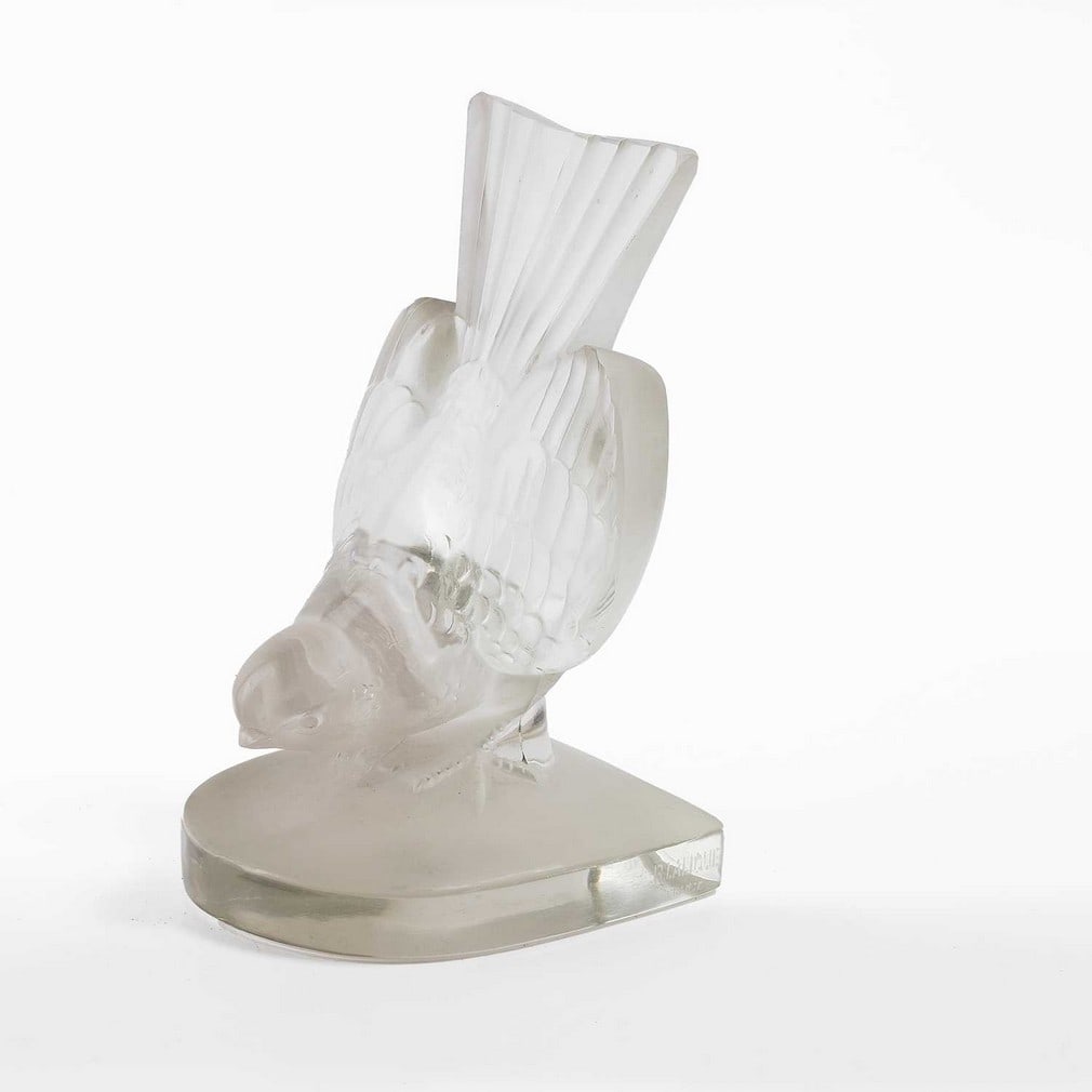 René Lalique (French, 1860-1945),: René Lalique (French, 1860-1945), a 'Hirondelle' bookend, designed in 1942, clear and frosted glass, acid etched 'R LALIQUE', 14.3cm high Condition Report: Overall good order. Minor surface wear 