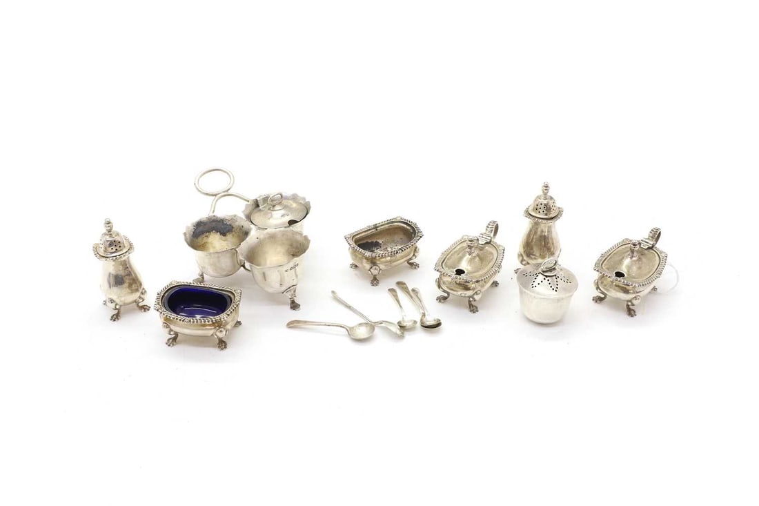 A collection of cruet items,: A collection of cruet items, to include a pair of salts, and mustards by Mappin & Webb Ltd, Birmingham, 1970, salts 6cm wide, and mustards 8cm wide, pepperettes and spoons (qty.)total weighable 1