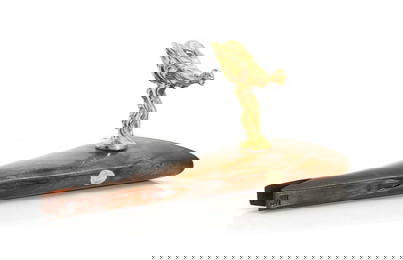 A gilded 'Spirit of Ecstasy' car mascot,