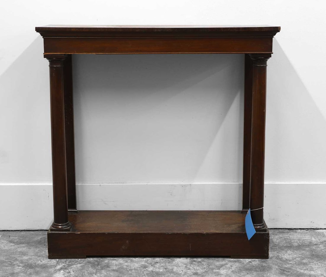 A small mahogany console table,: A small mahogany console table, early 19th century, with column front supports united by a solid base, 92cm wide33cm deep90cm high Condition Report Some staining, marks and scratches to the surface.