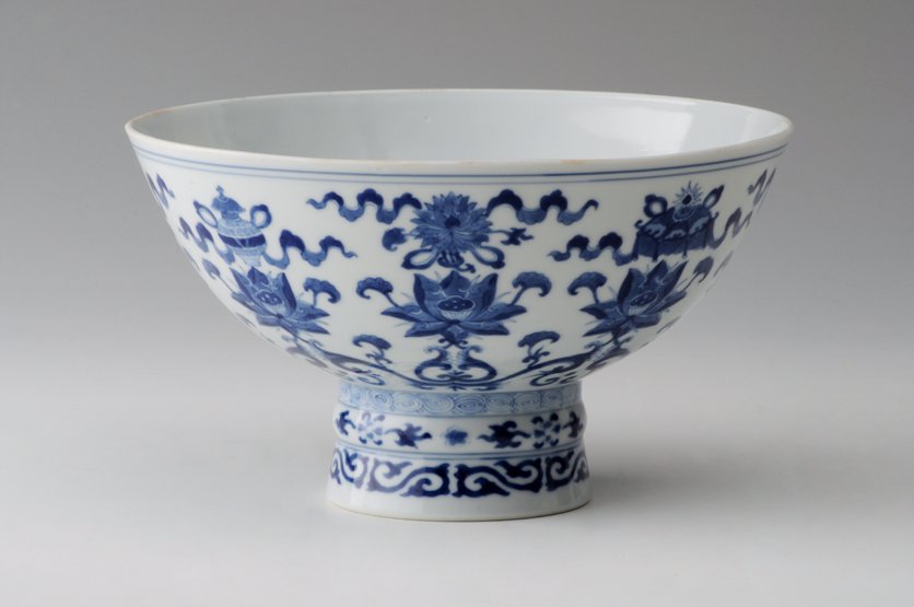 A Chinese Imperial porcelain blue and white Stem Bowl, : A Chinese Imperial porcelain blue and white Stem Bowl, Qianlong seal mark and period, 1736-1795, painted on the exterior with the Eight Buddhist emblems, each above a lotus bloom, the interior with a 