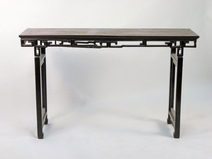A Chinese hardwood Altar Table, 19th century, the recta: A Chinese hardwood Altar Table, 19th century, the rectangular top on a key fret apron, one end detached, on square legs with inset windows, frame loose, 147cm wide 46cm deep, 89.5cm high