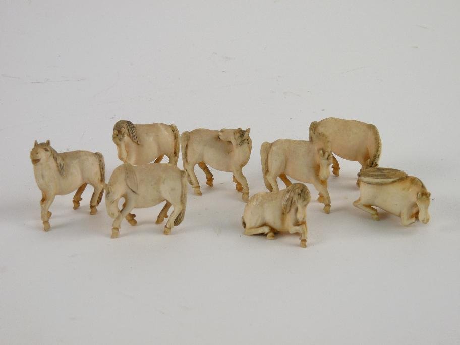 A set of eight Chinese ivory horses of Wu Mang, early 2: A set of eight Chinese ivory horses of Wu Mang, early 20th century, hoof missing
