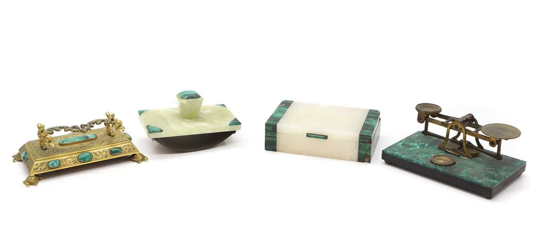 A gilt metal and malachite mounted pen rest,: A gilt metal and malachite mounted pen rest, by Howell James & Co, Regent Street London, with engraved decoration and raised on turtle feet,16cm wide10cm deep8cm hightogether with a set of malchi