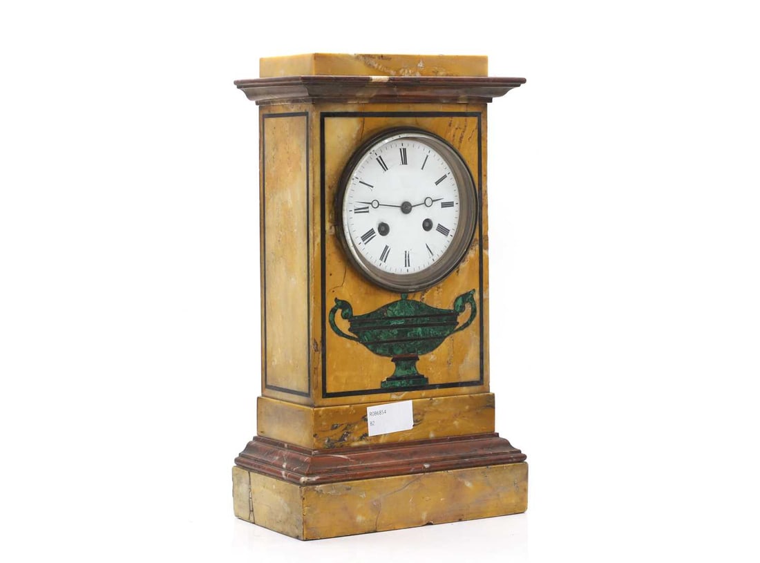 An Empire sienna marble mantel clock,: An Empire sienna marble mantel clock, 19th century, French, the 9.5cm enamel dial supporting a striking drum movement, the body with an inlaid malachite urn, strung borders and moulded rouge marble d