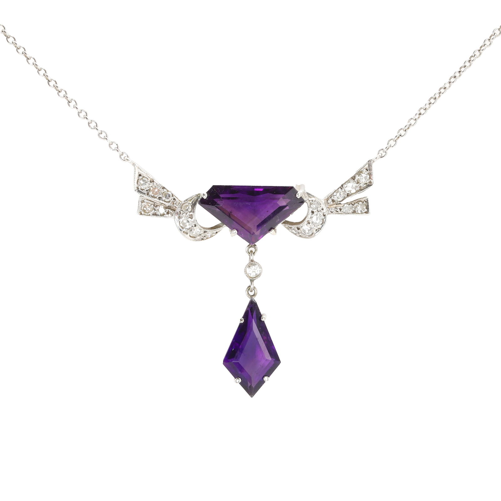 A 9ct white gold amethyst and diamond pendant necklace,: A 9ct white gold amethyst and diamond pendant necklace, in the Art Deco style, with a triangular cut amethyst, 15mm x 9mm, claw set and flanked by ribbon like lines of eight cut diamonds, suspending a