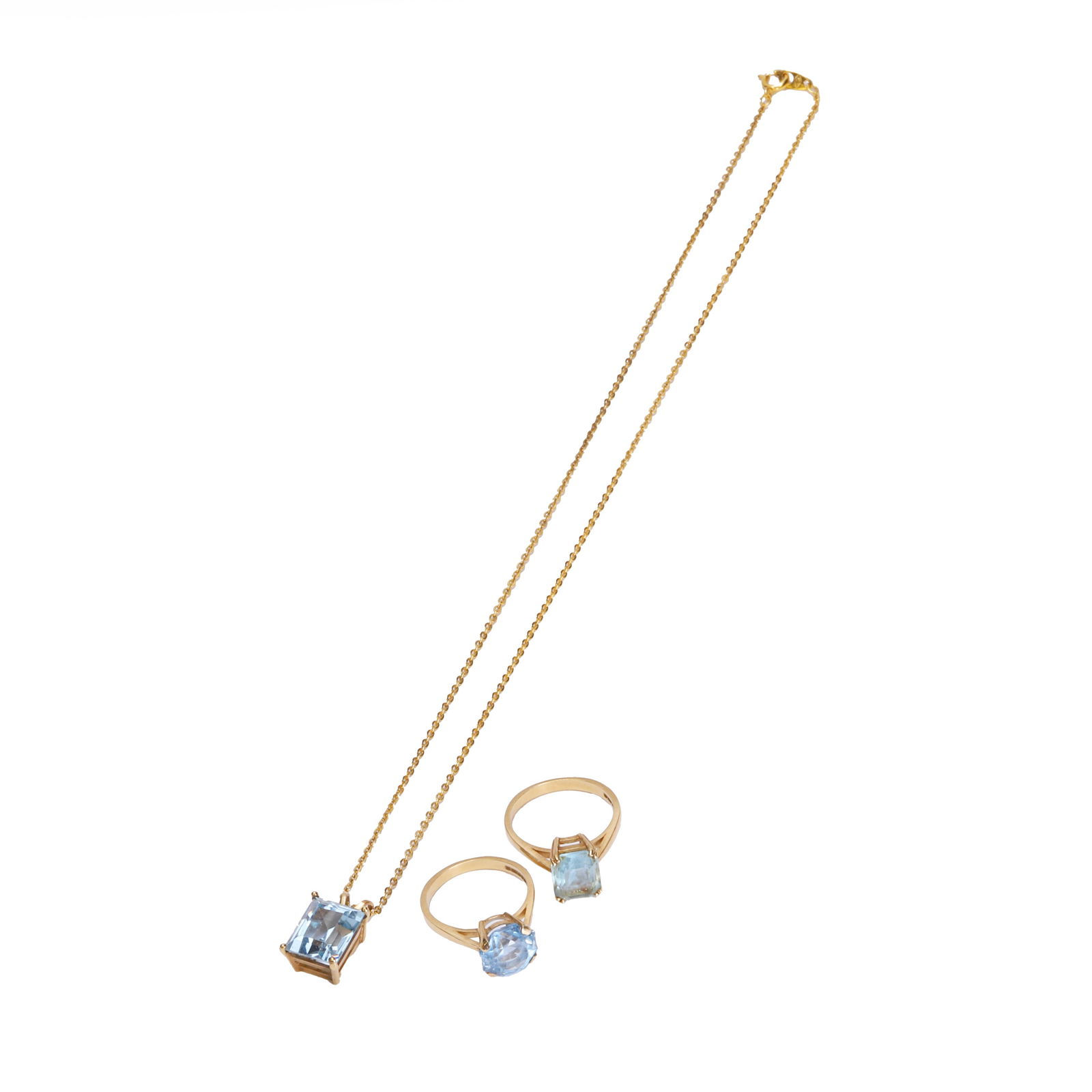 A group of gold synthetic blue spinel jewellery,: A group of gold synthetic blue spinel jewellery, comprising two 9ct gold synthetic blue spinel single stone rings, Sheffield 1993, and a synthetic blue spinel pendant, suspended by a cable link chain,