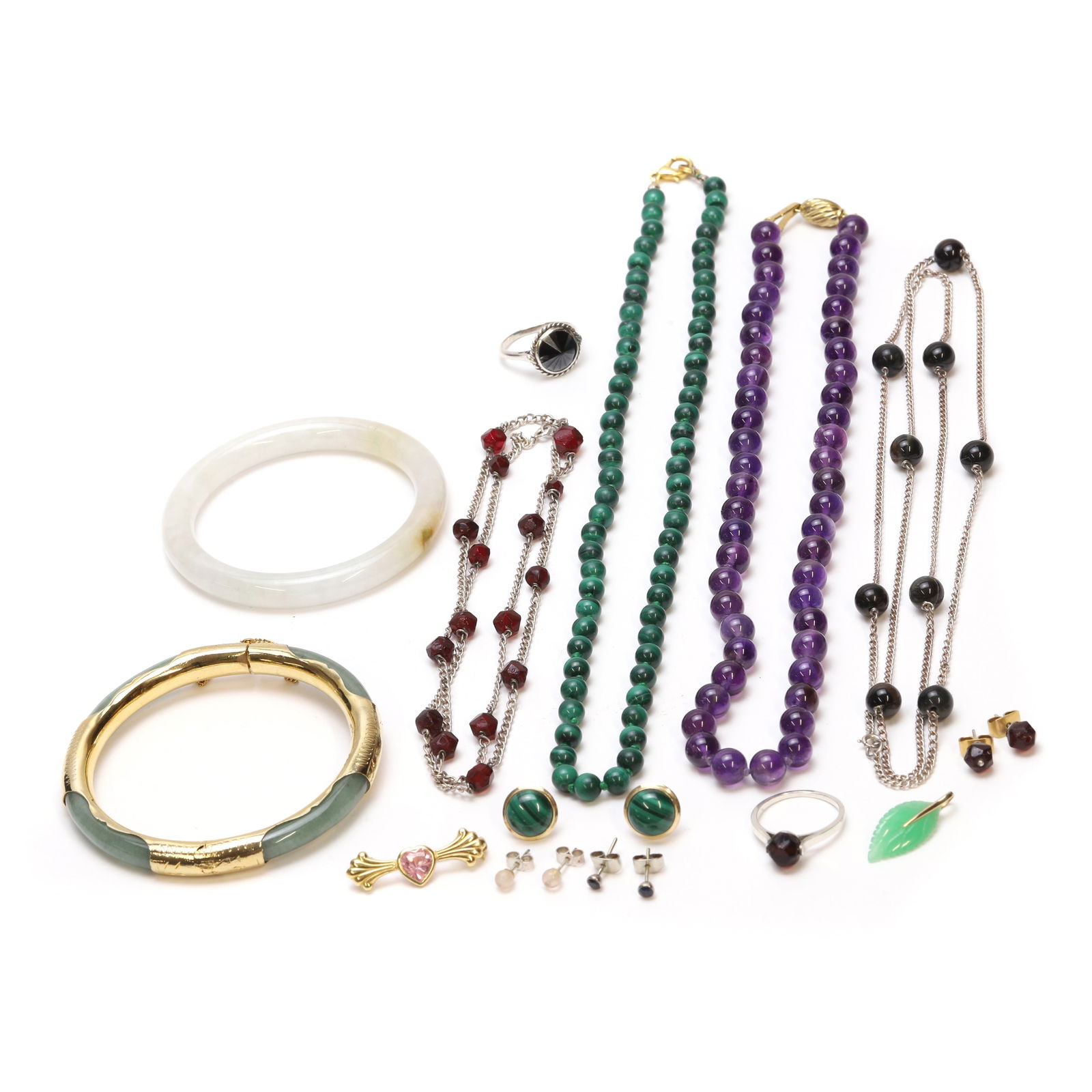 A group of gold, silver and costume jewellery,: A group of gold, silver and costume jewellery, comprising a pink cubic zirconia brooch, a pair of sapphire stud earrings, both tested as approximately 18ct gold, a pair of malachite stud earrings, sta